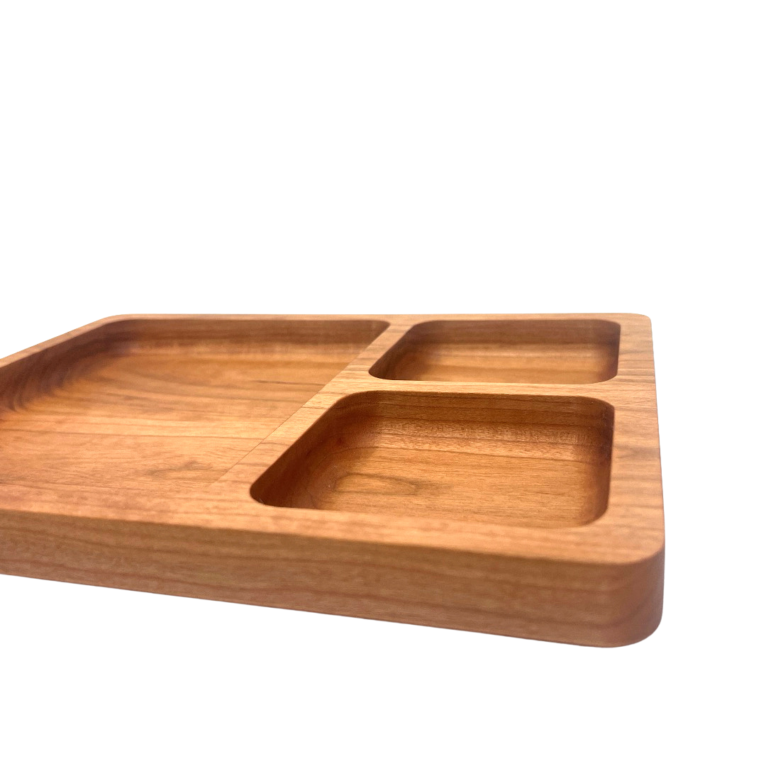 Wooden tray with compartments on a white background