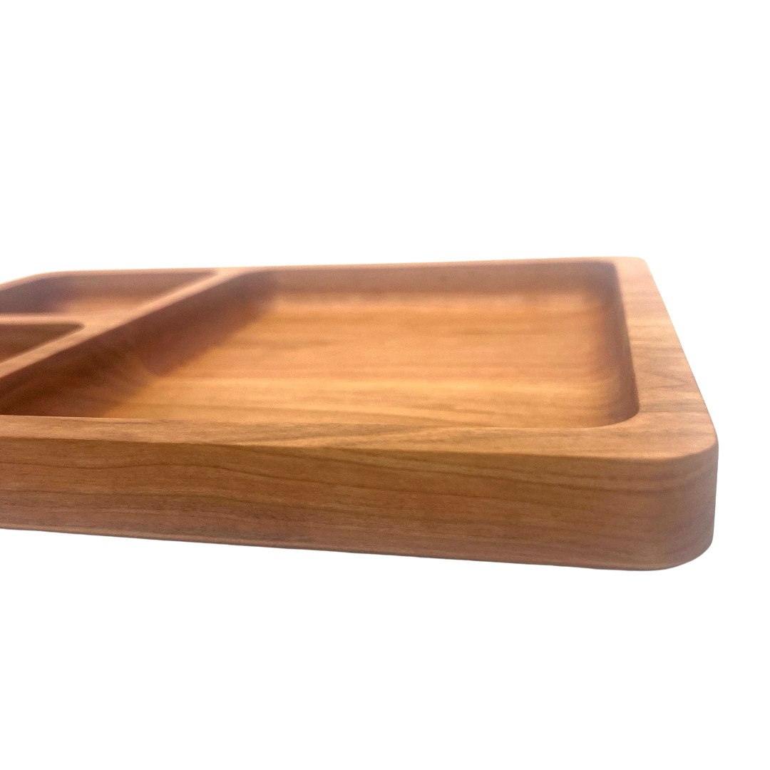 Wooden tray with compartments on a white background
